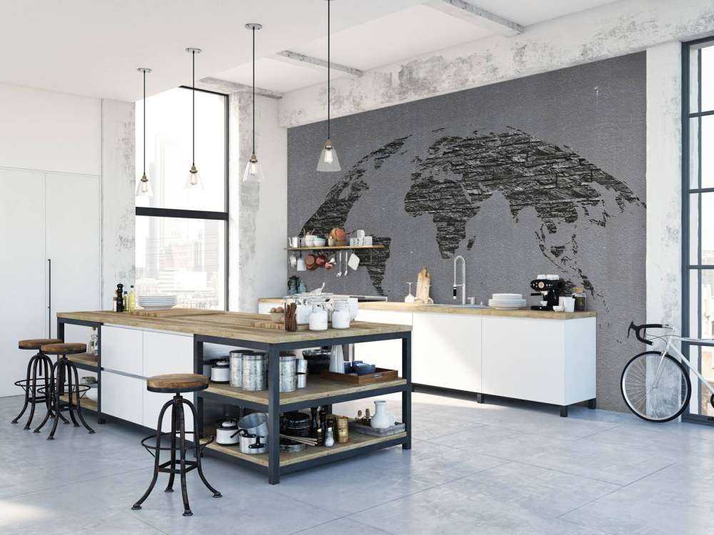 Pierres de la carte du monde sur du béton gris