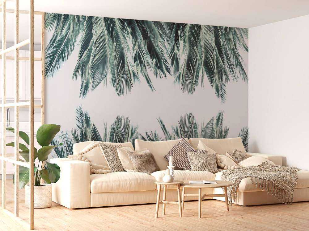 Feuilles de palmier bleu canard sur fond blanc