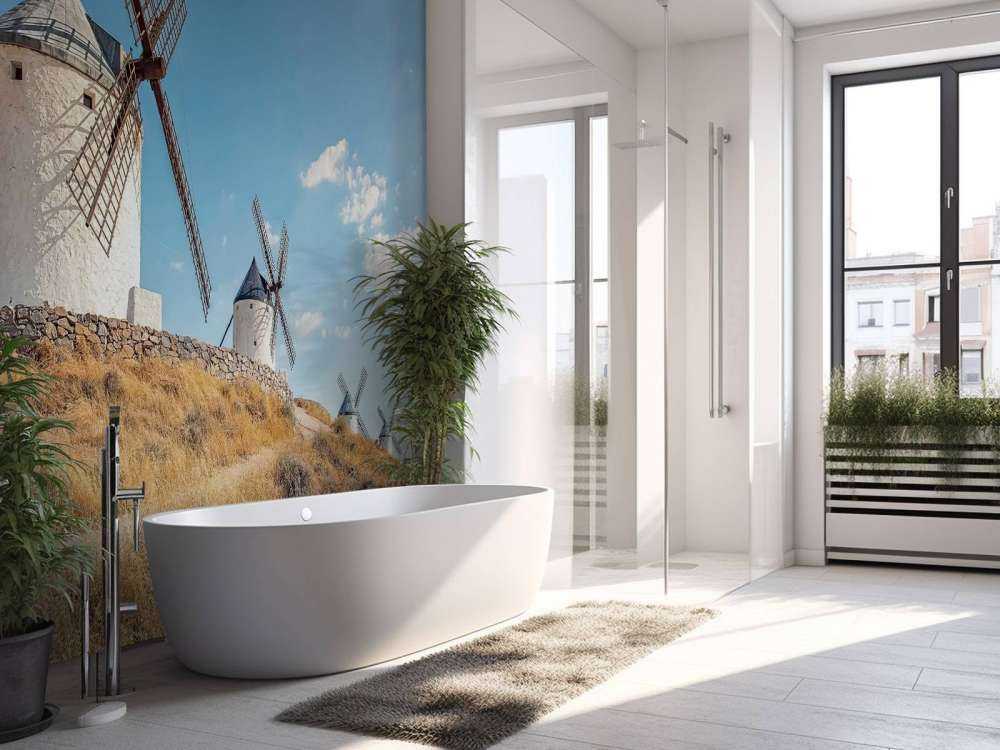 Colline d'été avec des moulins à vent blancs