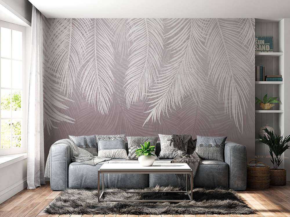 Feuilles de palmier sur un mur en béton