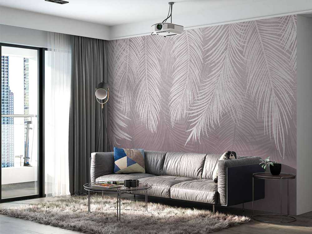 Feuilles de palmier sur un mur en béton