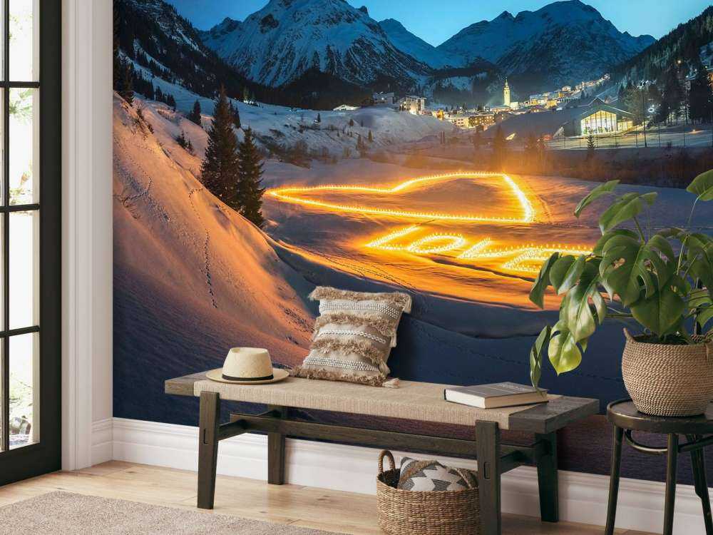 Art lumineux dans un village de montagne en hiver