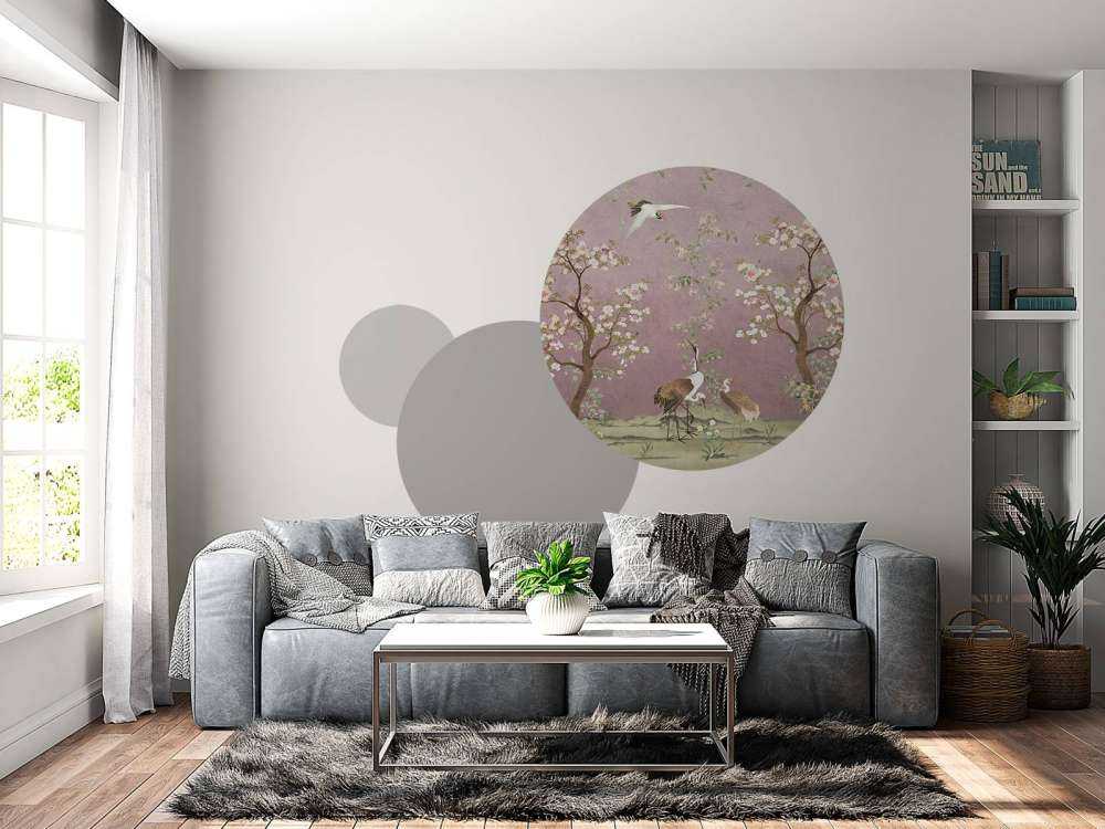 Grues sous un ciel rose en fleurs