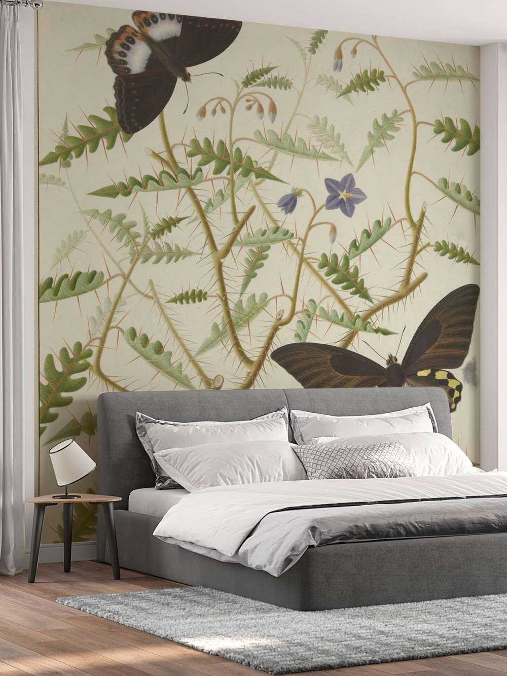 Un arbuste en fleurs avec deux papillons exotiques