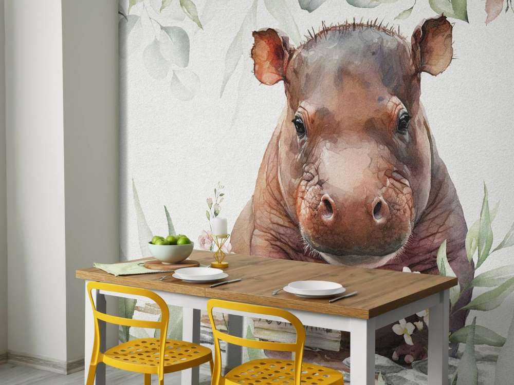 Bébé hippopotame dans les feuilles