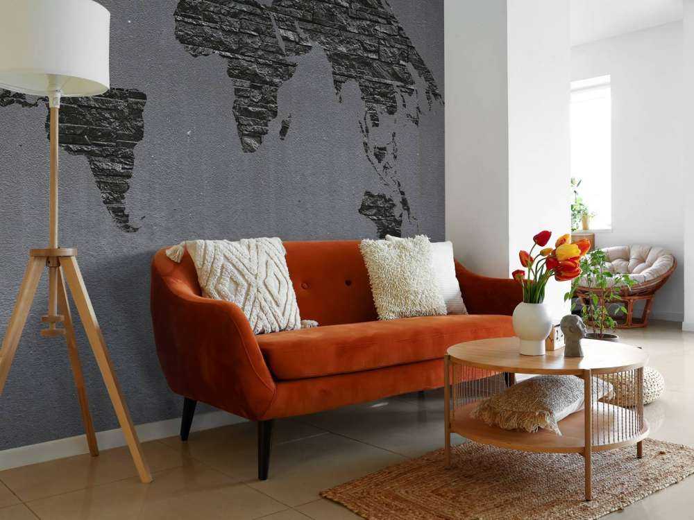 Pierres de la carte du monde sur du béton gris