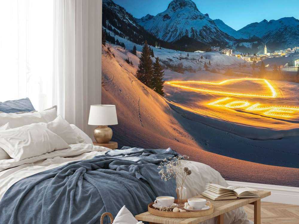 Art lumineux dans un village de montagne en hiver