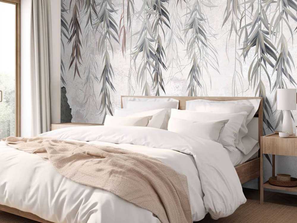 Branches suspendues sur un mur en béton