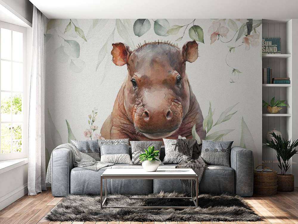 Bébé hippopotame dans les feuilles