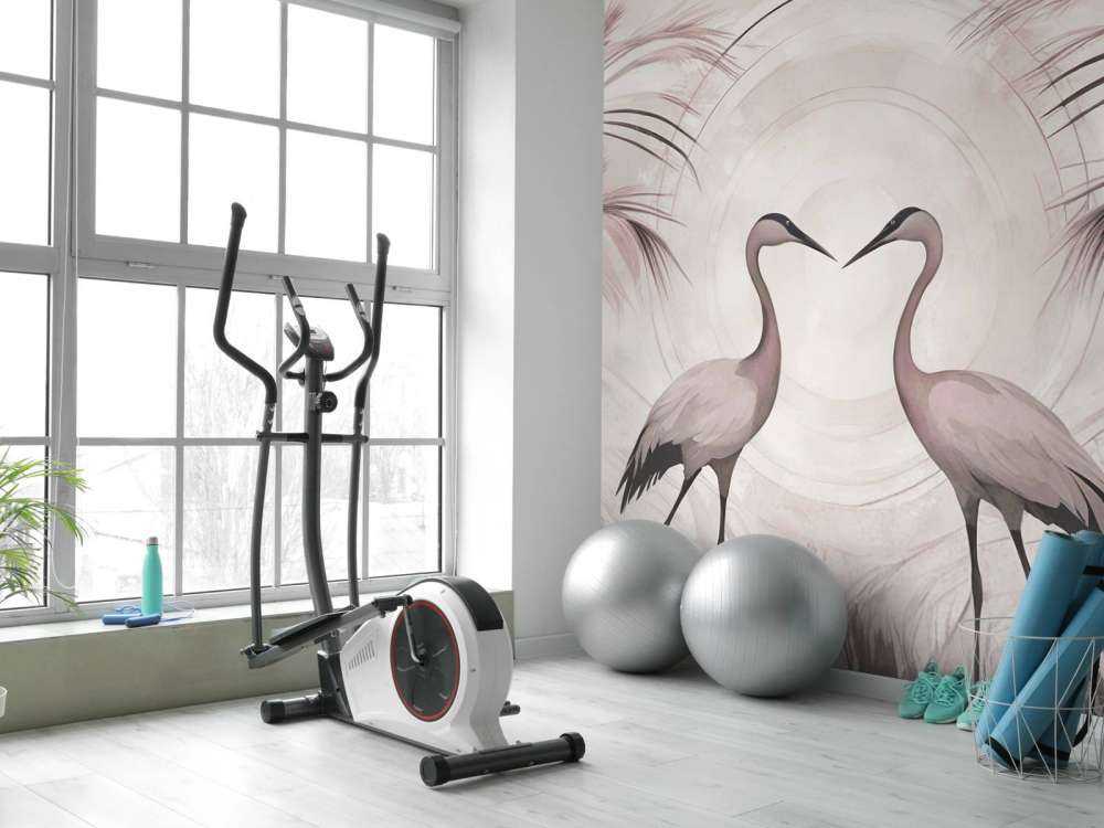 Grues au coucher du soleil rose