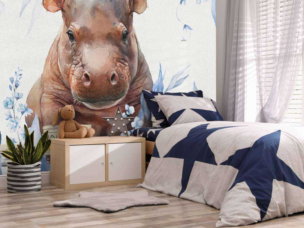 Bébé hippopotame dans les feuilles bleu