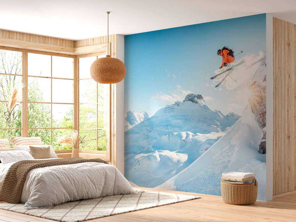 Saut dans un paysage montagneux enneigé