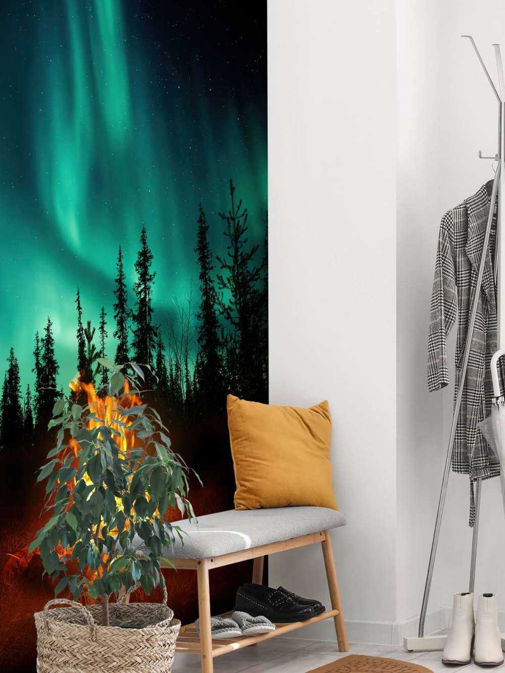 Feu de camp sous les aurores boréales