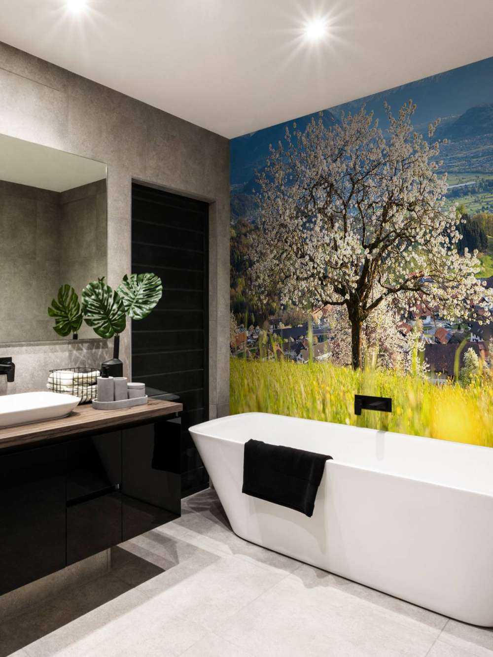 Cerisier en fleurs dans une prairie alpine