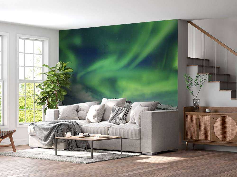 Aurore boréale au-dessus d'un paysage d'hiver