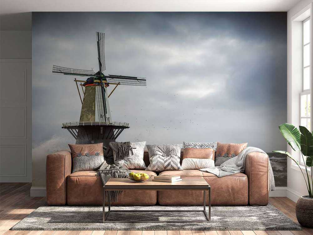 Moulin avec des vagues de tempête