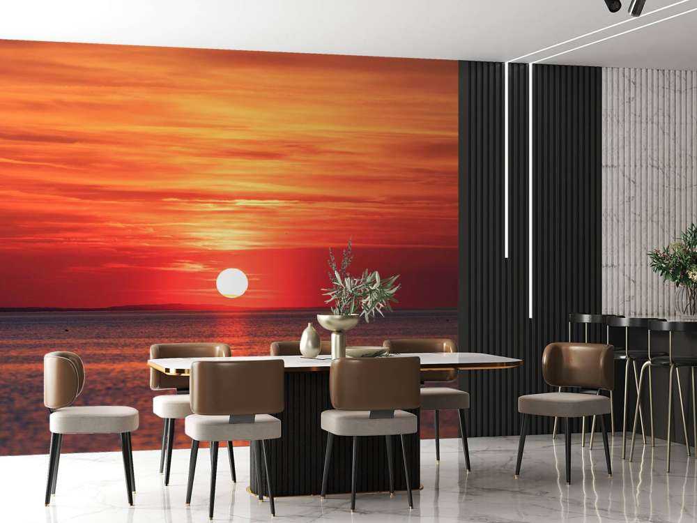 Coucher de soleil rouge feu sur une mer calme