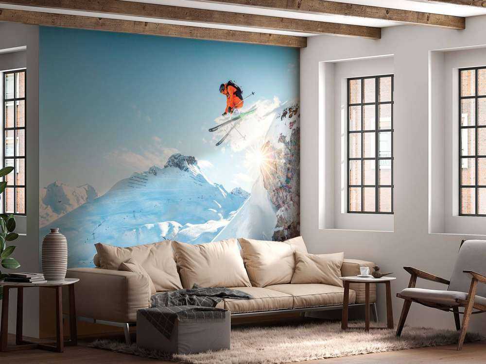 Saut dans un paysage montagneux enneigé