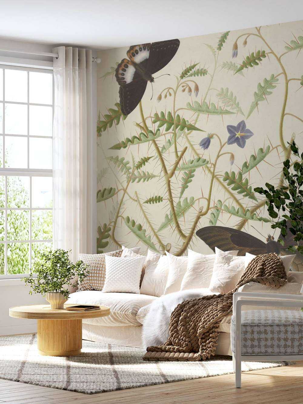 Un arbuste en fleurs avec deux papillons exotiques