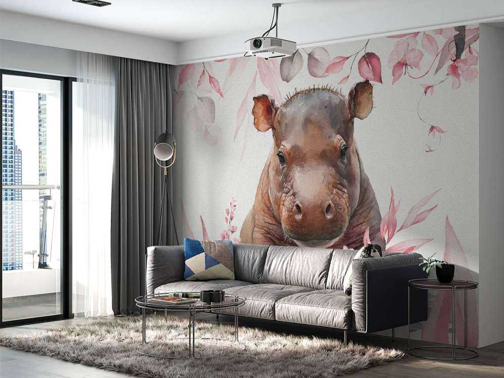 Bébé hippopotame dans les feuilles rose