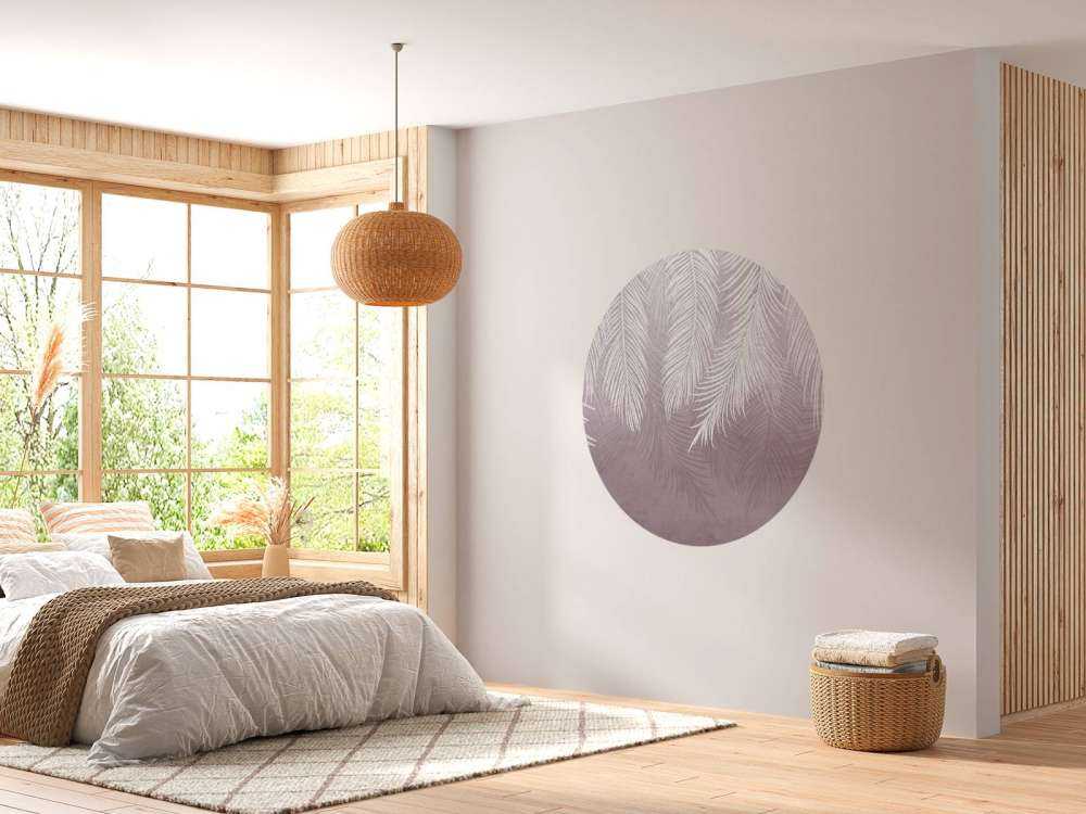 Feuilles de palmier sur un mur en béton