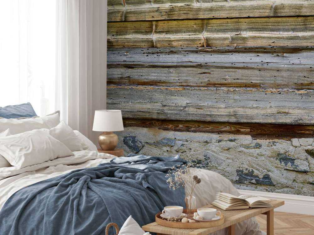 Bois vieilli sur un mur de pierre