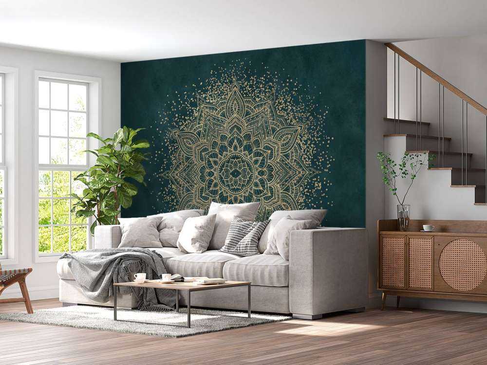 Mandala doré sur vert émeraude.