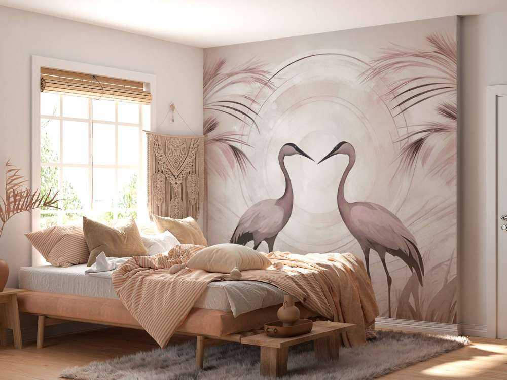 Grues au coucher du soleil rose