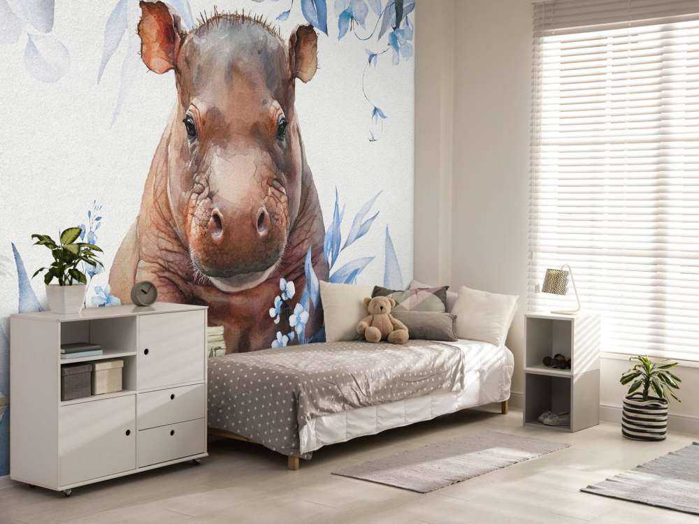 Bébé hippopotame dans les feuilles bleu