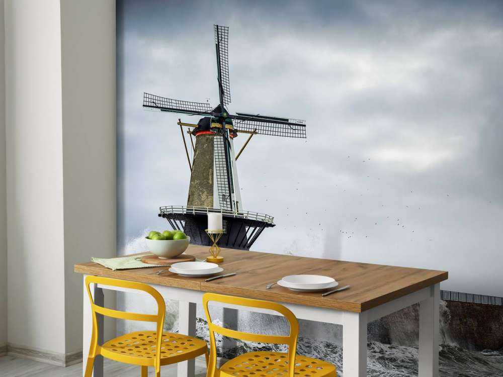 Moulin avec des vagues de tempête