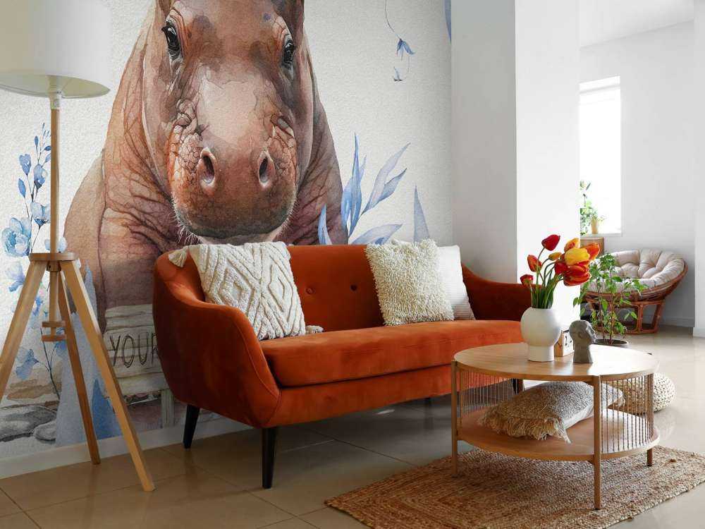 Bébé hippopotame dans les feuilles bleu