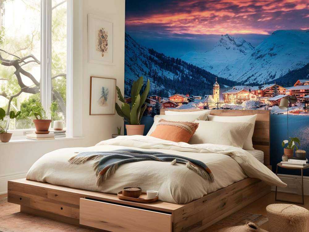 Lumière du soir sur un village de montagne enneigé