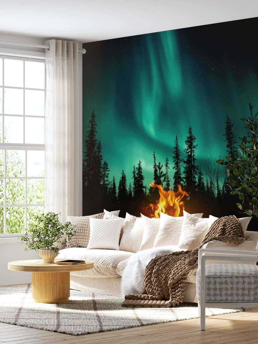 Feu de camp sous les aurores boréales