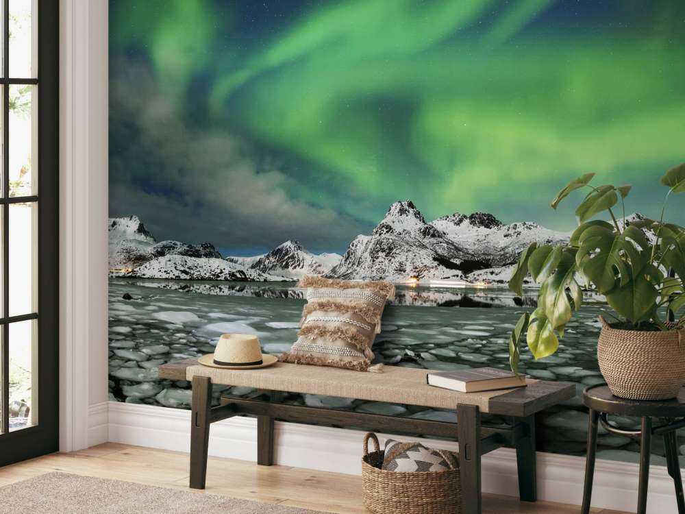 Aurore boréale au-dessus d'un paysage d'hiver