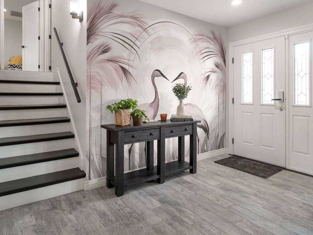 Grues au coucher du soleil rose