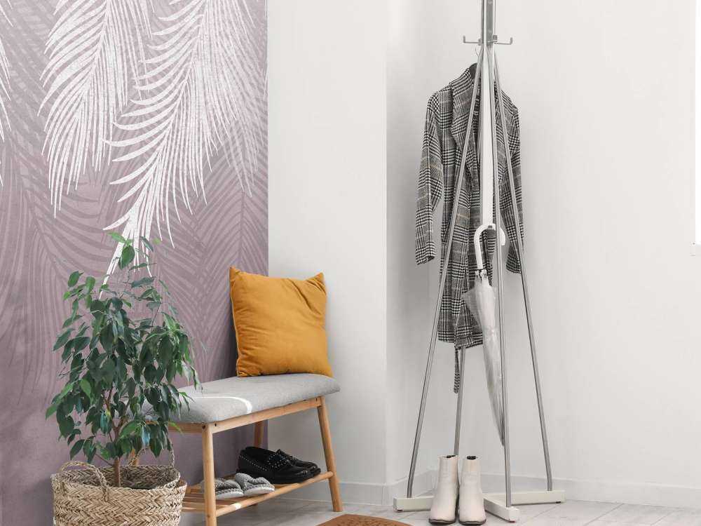 Feuilles de palmier sur un mur en béton