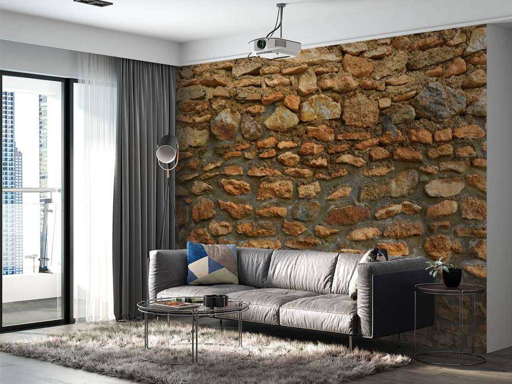 Grand mur avec des pierres brutes de différentes tailles