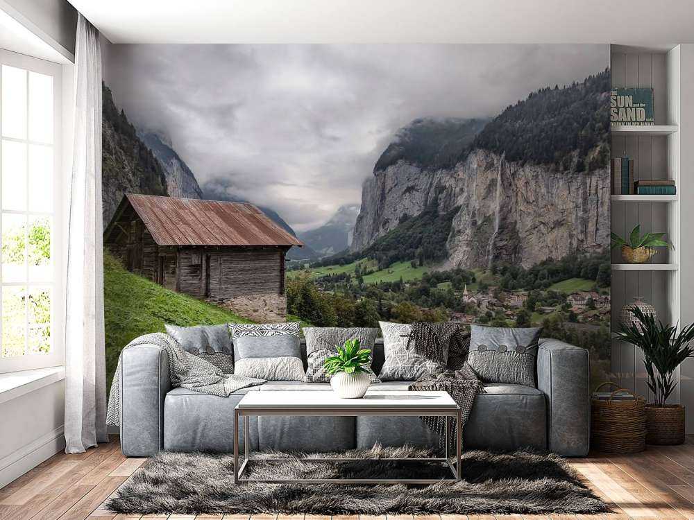 Vallée de montagne avec une cabane de montagne en bois