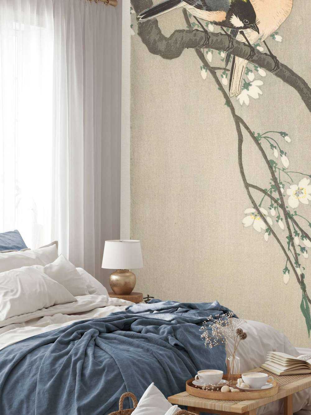 Nénés sur une branche fleurie