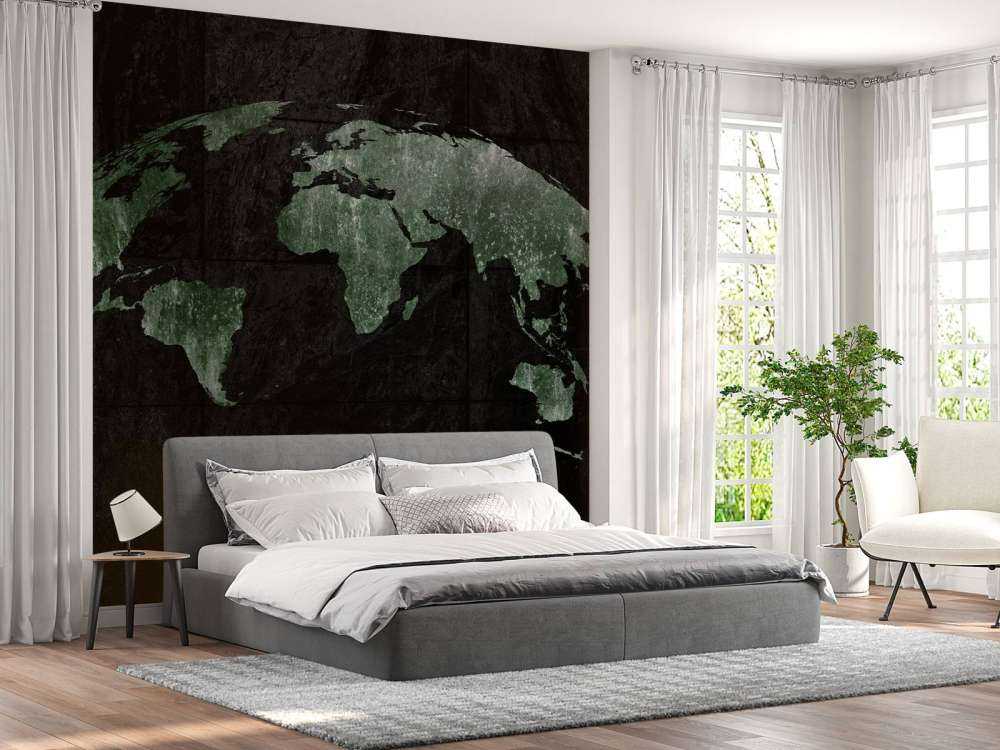 Carte du monde verte sur du béton