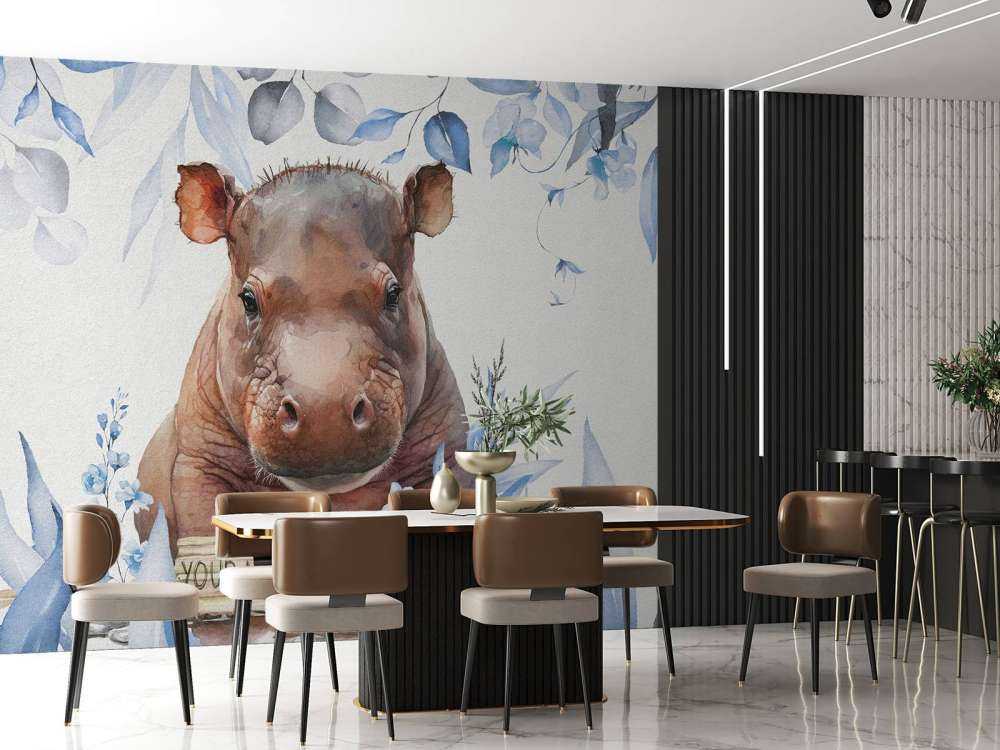 Bébé hippopotame dans les feuilles bleu