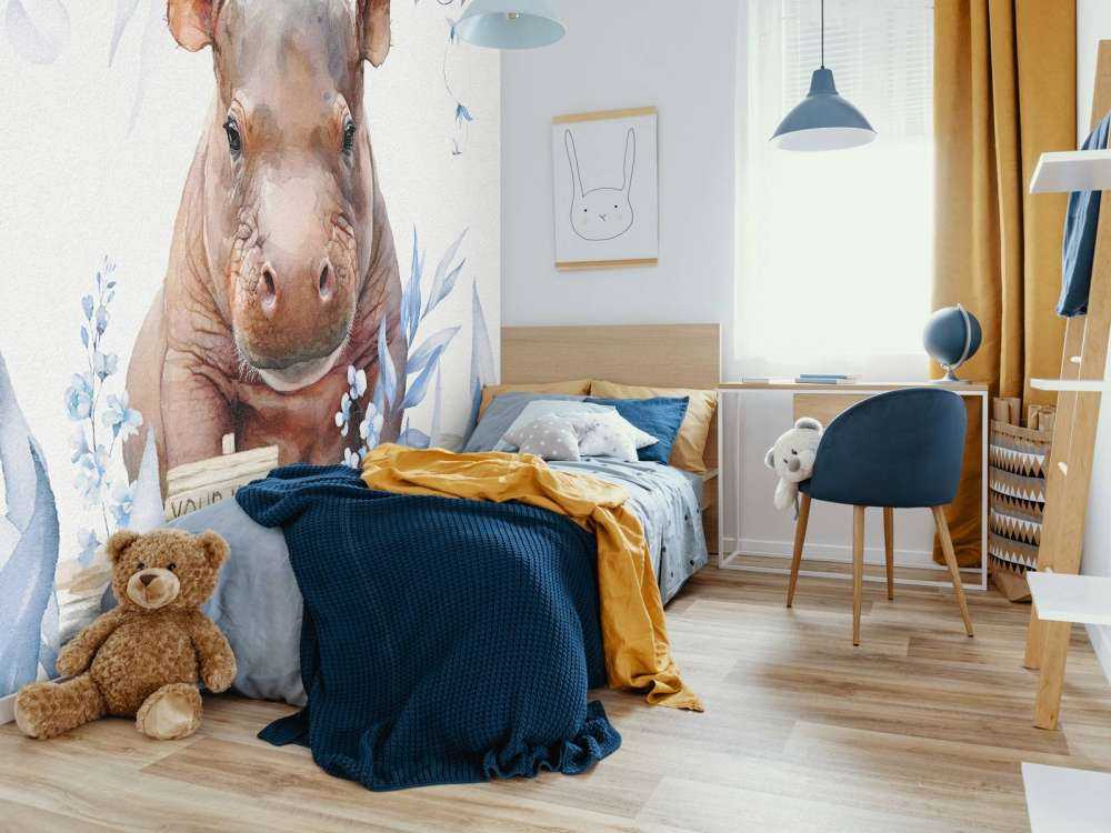 Bébé hippopotame dans les feuilles bleu