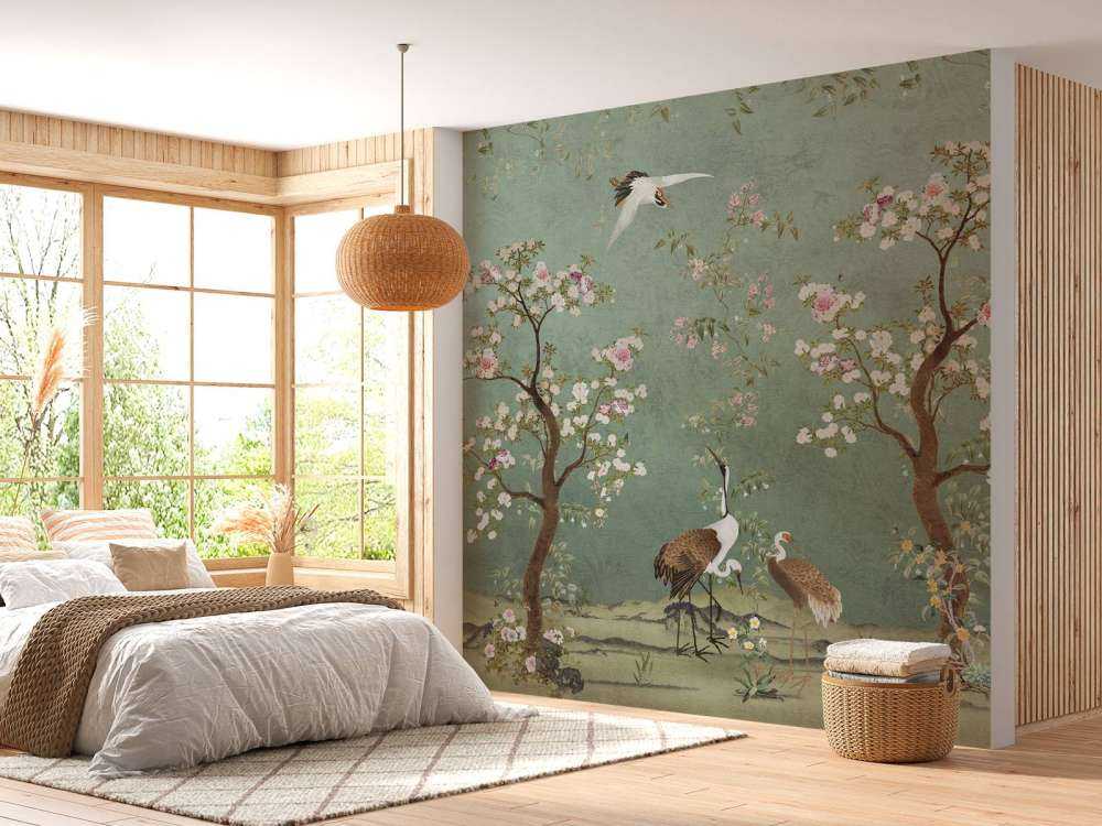 Gracieuses grues dans un paysage de fleurs.
