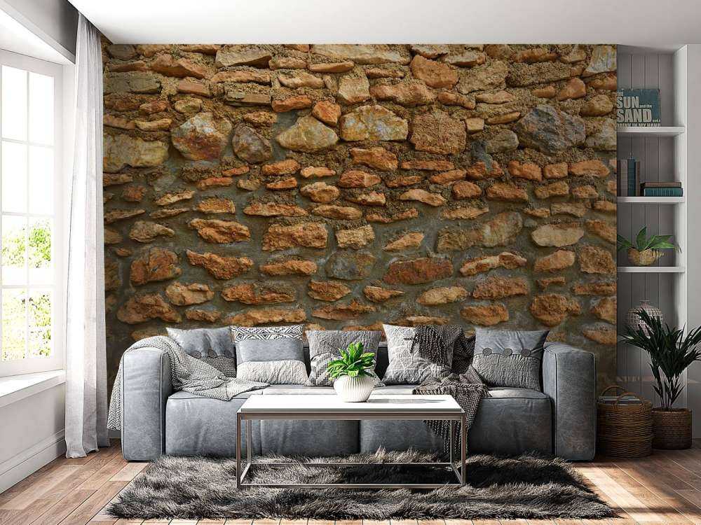 Grand mur avec des pierres brutes de différentes tailles