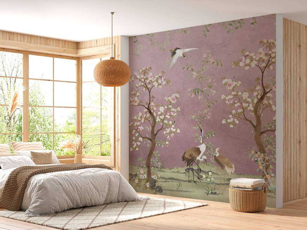 Grues sous un ciel rose en fleurs