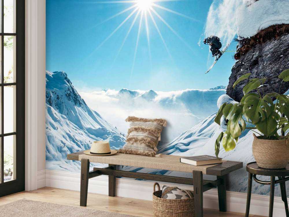 Saut libre dans un paysage enneigé baigné de soleil